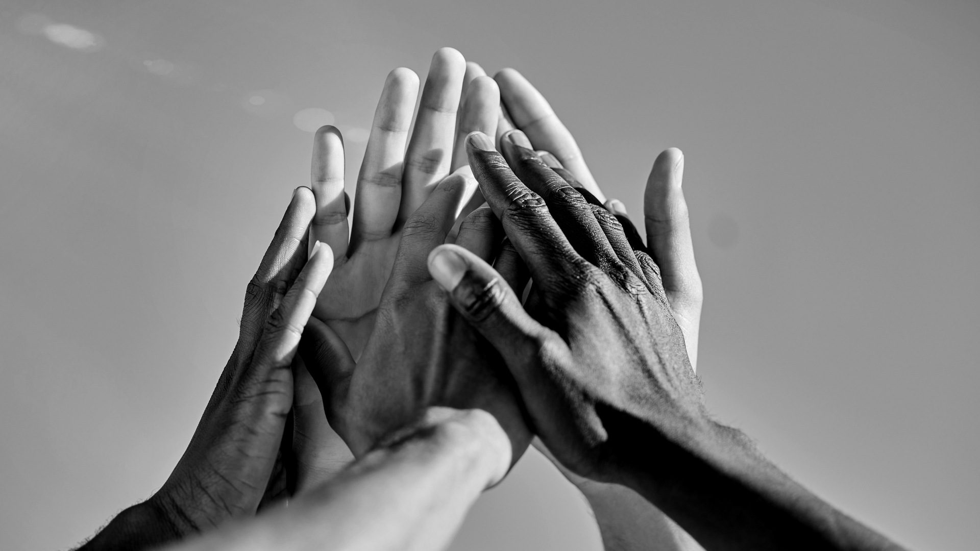 Photo of several hands joining together for page Our CSR politics